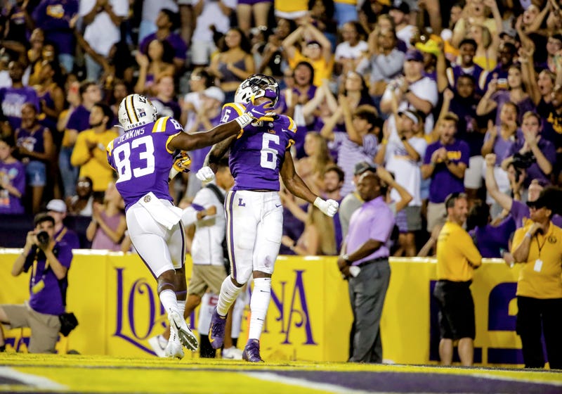 LSU Tigers wide receiver Terrace Marshall Jr. (6) celebrates with wide receiver Jaray Jenkins (83) after a touchdown catch against the Northwestern State Demons during the second quarter at Tiger Stadium.