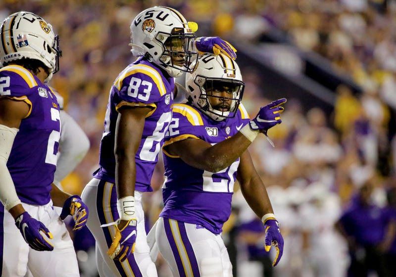 LSU Tigers running back Clyde Edwards-Helaire (22) celebrates with wide receiver Jaray Jenkins (83) during the second quarter against the Northwestern State Demons at Tiger Stadium.