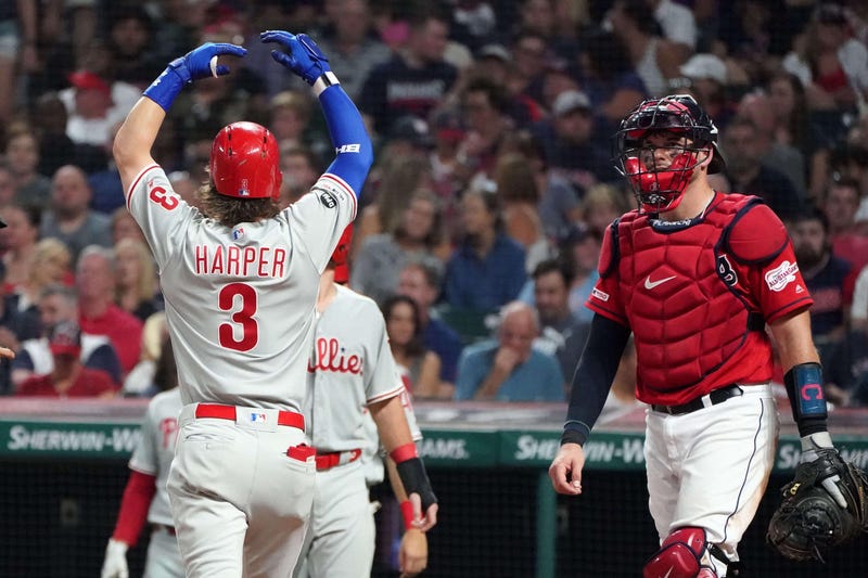 Sep 21, 2019; Cleveland, OH, USA; Philadelphia Phillies right fielder Bryce Harper (3) celebrates after hitting a three-run home run in the fifth inning as Cleveland Indians catcher Kevin Plawecki (right) looks on at Progressive Field. Mandatory Credit: K