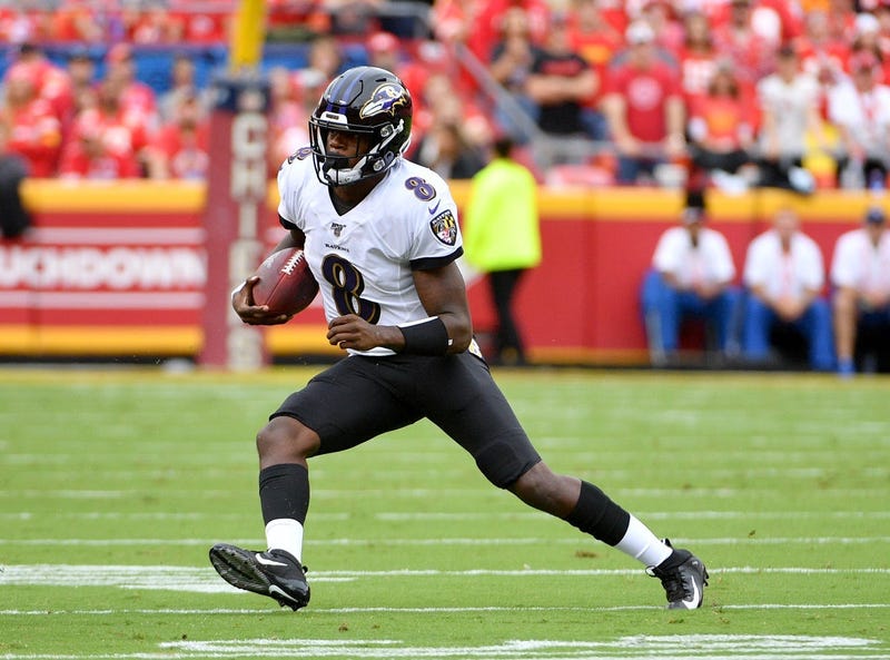 Baltimore Ravens quarterback Lamar Jackson (8) runs the ball during the first half against the Kansas City Chiefs at Arrowhead Stadium.