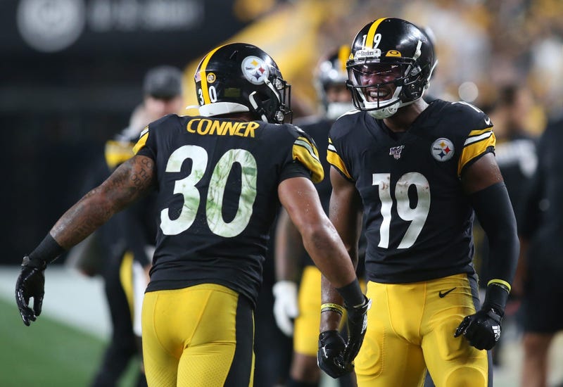 Pittsburgh Steelers running back James Conner (30) and wide receiver JuJu Smith-Schuster (19) celebrate a Steelers touchdown