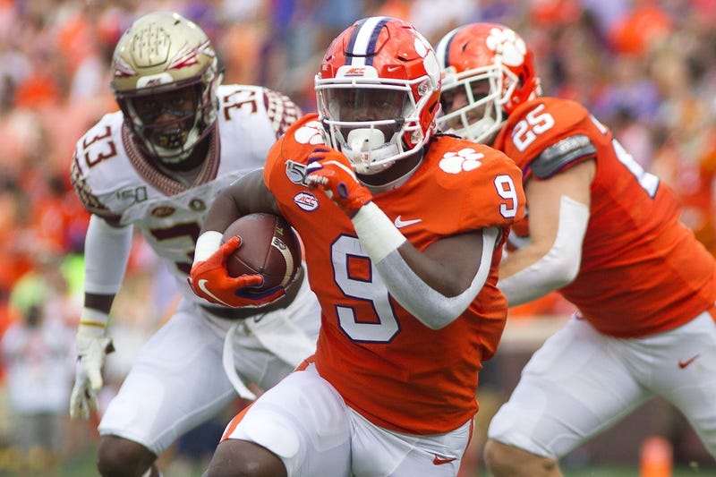 Clemson Tigers running back Travis Etienne (9) carries the ball during the first quarter of the game against the Florida State Seminoles at Clemson Memorial Stadium.
