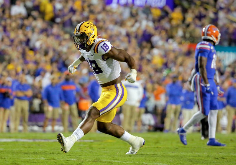 LSU Tigers linebacker K'Lavon Chaisson (18) reacts after a defensive stop against the Florida Gators during the first quarter at Tiger Stadium.