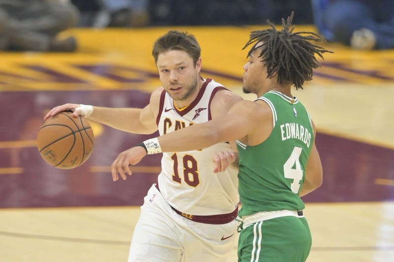 Oct 15, 2019; Cleveland, OH, USA; Cleveland Cavaliers guard Matthew Dellavedova (18) drives against Boston Celtics guard Carsen Edwards (4) in the first quarter at Rocket Mortgage FieldHouse. Mandatory Credit: David Richard-USA TODAY Sports
