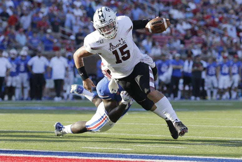 Temple Owls quarterback Anthony Russo (15) scores a touchdown in the fourth quarter against the Southern Methodist Mustangs at Gerald J. Ford Stadium.