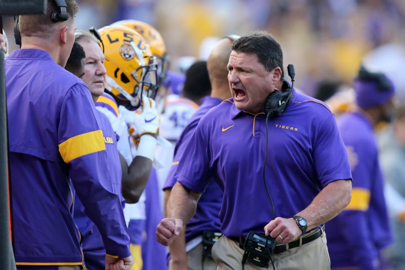 LSU Tigers head coach Ed Orgeron yell on the sidelines in the second half against the Auburn Tigers at Tiger Stadium.