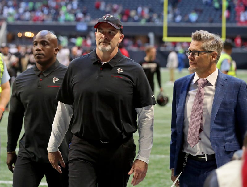 Oct 27, 2019; Atlanta, GA, USA; Atlanta Falcons head coach Dan Quinn (middle) leaves the field with general manager Thomas Dimitroff (right) after a loss to the Seattle Seahawks at Mercedes-Benz Stadium. Mandatory Credit: Jason Getz-USA TODAY Sports