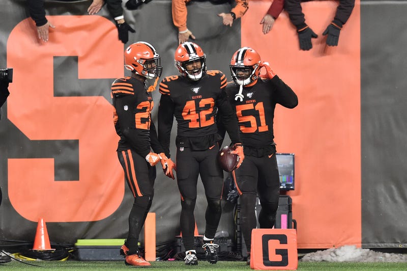 Cleveland Browns strong safety Morgan Burnett (42) celebrates with free safety Damarious Randall (23) and linebacker Mack Wilson (51)