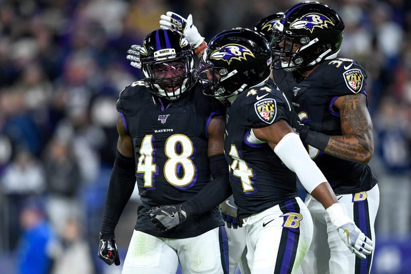 Baltimore Ravens inside linebacker Patrick Onwuasor (48) is congratulated by his teammates cornerback Marlon Humphrey (44) and defensive back Chuck Clark (36) after a sack during the first quarter against the New England Patriots at M&T Bank Stadium.