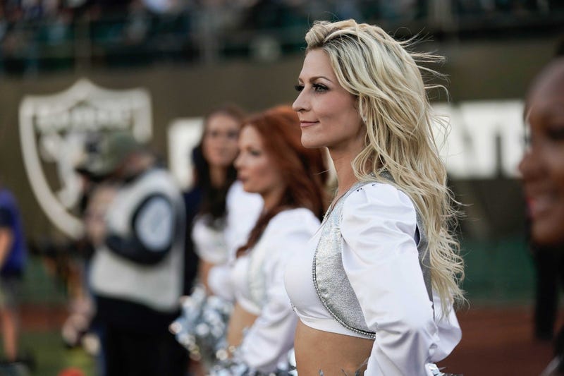 Nov 17, 2019; Oakland, CA, USA; Oakland Raiders cheerleader watches the game against the Cincinnati Bengals during the fourth quarter at the Oakland Coliseum. Mandatory Credit: Stan Szeto-USA TODAY Sports