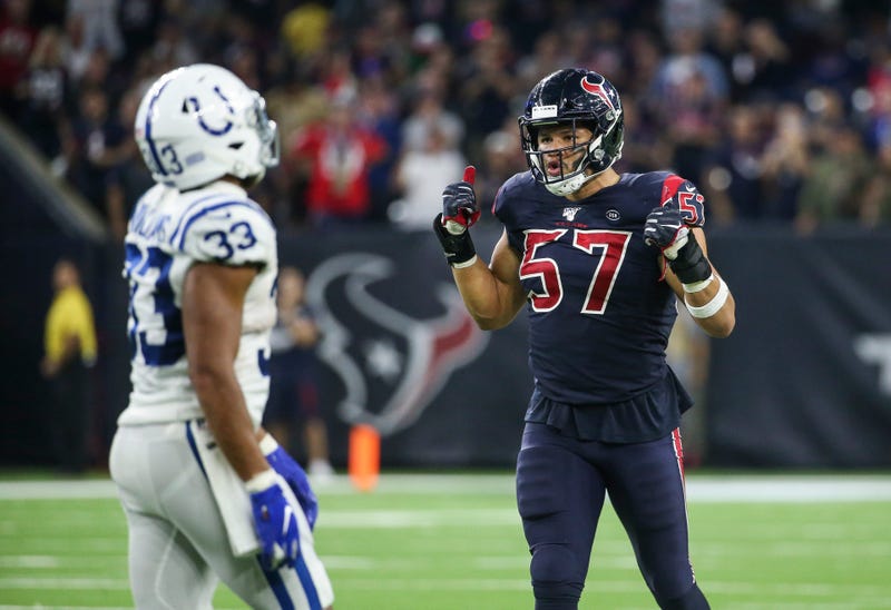 Houston Texans outside linebacker Brennan Scarlett (57) and Indianapolis Colts running back Jonathan Williams (33) react after a play during the fourth quarter at NRG Stadium.