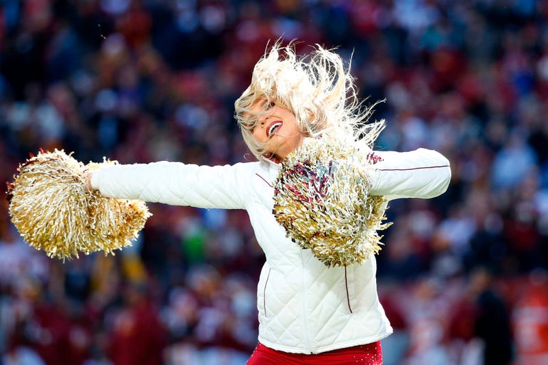 Nov 24, 2019; Landover, MD, USA; A Washington Redskins cheerleader performs on the field after the Redskins' score a touchdown against the Detroit Lions during the first half at FedExField. Mandatory Credit: Amber Searls-USA TODAY Sports