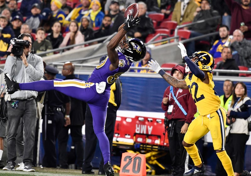 Miles Boykin reels in a catch in front of a Rams defender