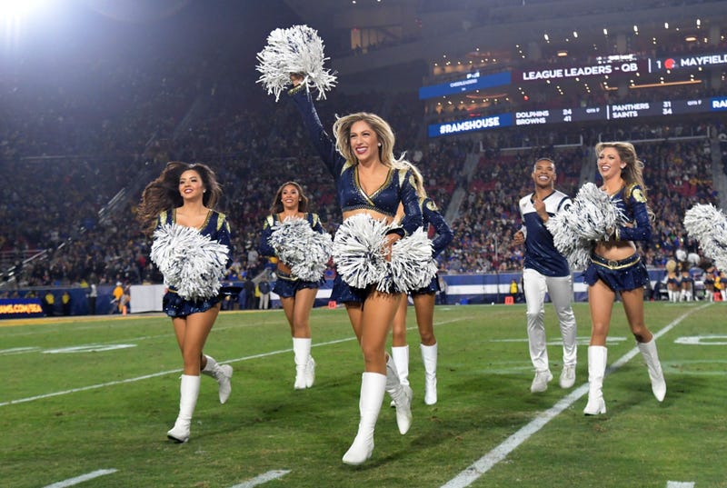 Nov 25, 2019; Los Angeles, CA, USA; Los Angeles Rams male cheerleader Napoliean Jinnies performs with female cheerleaders during the game against the Baltimore Ravens at Los Angeles Memorial Coliseum. Mandatory Credit: Kirby Lee-USA TODAY Sports