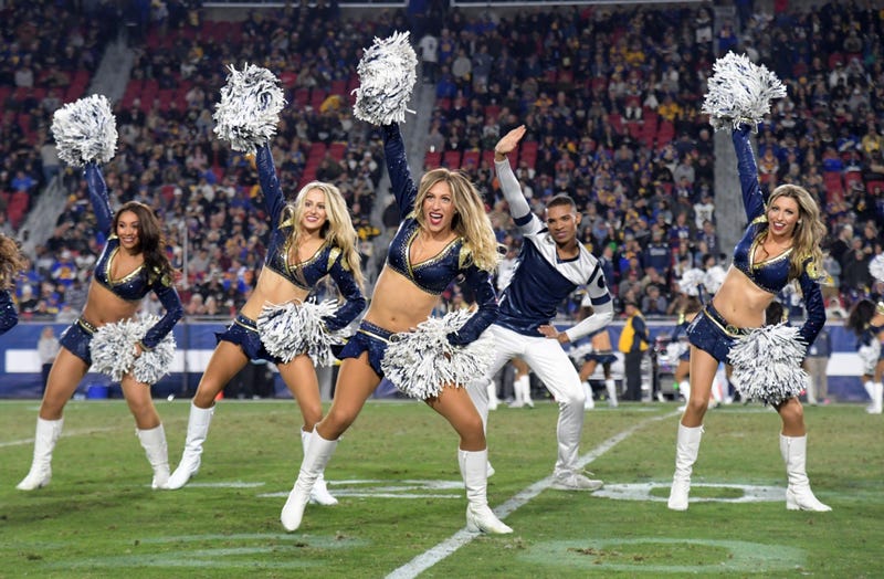 Nov 25, 2019; Los Angeles, CA, USA; Los Angeles Rams male cheerleader Napoliean Jinnies performs with female cheerleaders during the game against the Baltimore Ravens at Los Angeles Memorial Coliseum. Mandatory Credit: Kirby Lee-USA TODAY Sports