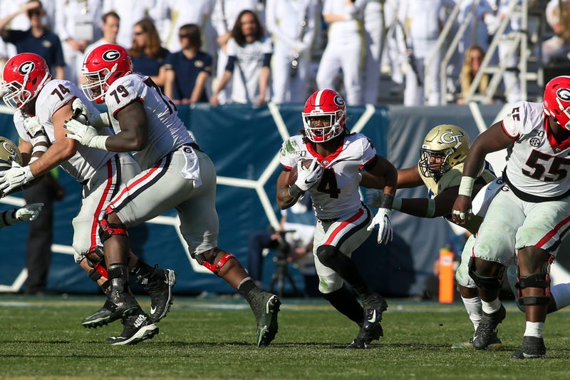 Nov 30, 2019; Atlanta, GA, USA; Georgia Bulldogs running back James Cook (4) runs the ball against the Georgia Tech Yellow Jackets in the second half at Bobby Dodd Stadium. Mandatory Credit: Brett Davis-USA TODAY Sports