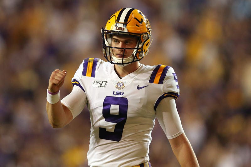 LSU Tigers quarterback Joe Burrow (9) gestures after a touchdown against the Texas A&M Aggies in the second quarter at Tiger Stadium.