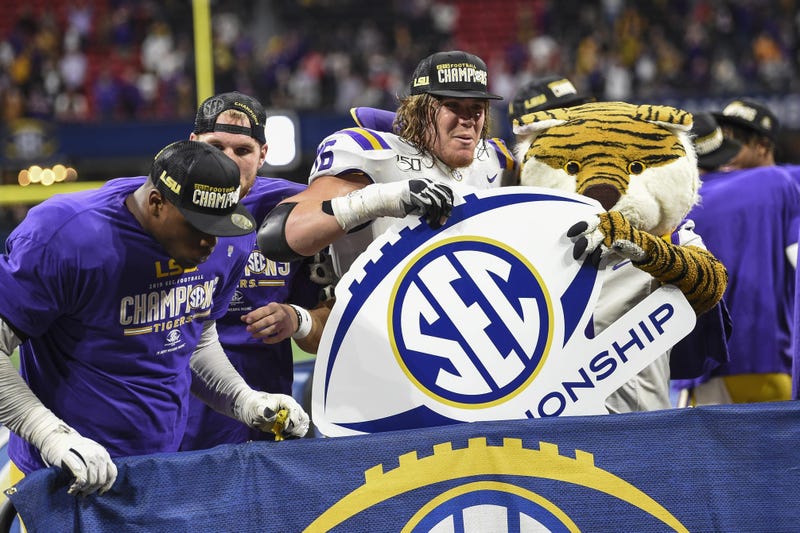 LSU Tigers players celebrate after defeating the Georgia Bulldogs in the 2019 SEC Championship Game at Mercedes-Benz Stadium.