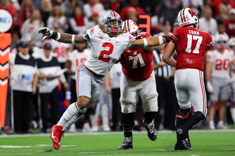 Dec 7, 2019; Indianapolis, IN, USA; Ohio State Buckeyes defensive end Chase Young (2) grabs onto the jersey of Wisconsin Badgers quarterback Jack Coan (17) as he throws during the first half in the 2019 Big Ten Championship Game at Lucas Oil Stadium.