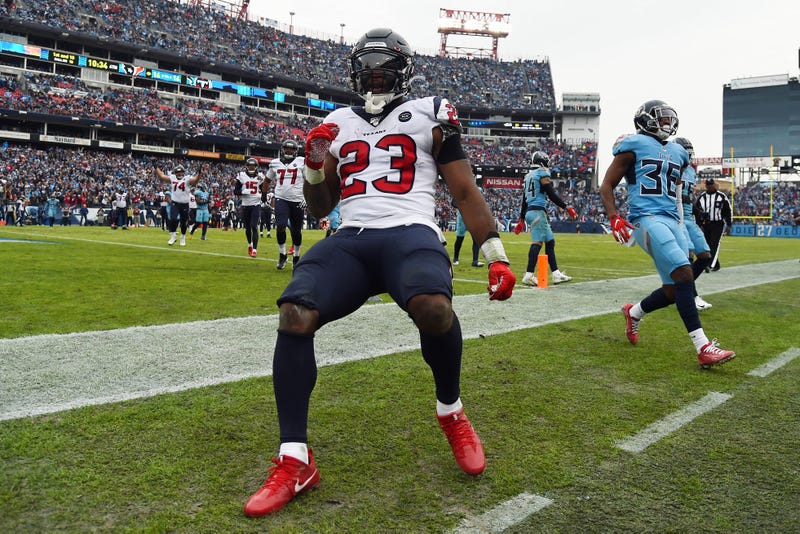 Houston Texans running back Carlos Hyde (23) runs for a touchdown during the second half against the Tennessee Titans at Nissan Stadium.
