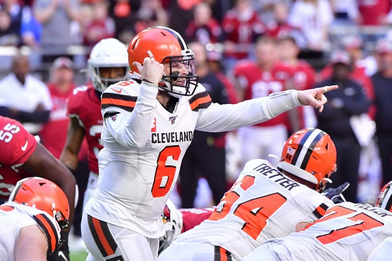 Cleveland Browns quarterback Baker Mayfield (6) signals to teammates during the first half against the Arizona Cardinals at State Farm Stadium.