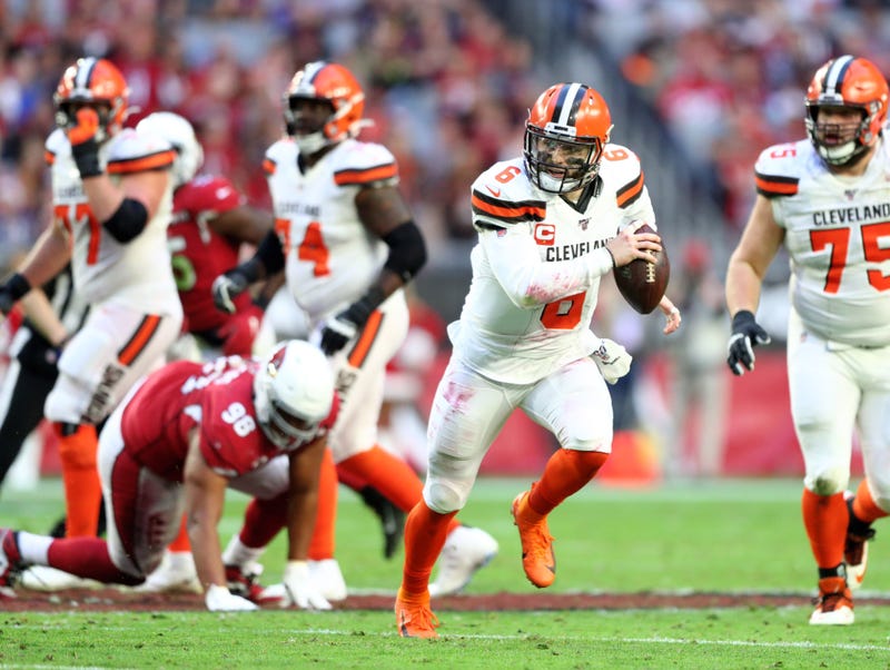 Cleveland Browns quarterback Baker Mayfield (6) runs the ball against the Arizona Cardinals at State Farm Stadium.