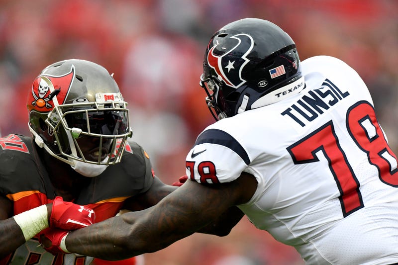 Tampa Bay Buccaneers linebacker Jason Pierre-Paul (90) rushes the passer as Houston Texans offensive tackle Laremy Tunsil (78) defends during the fourth quarter at Raymond James Stadium.