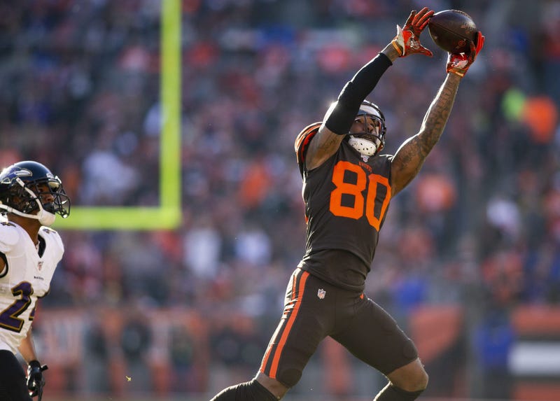 Cleveland Browns wide receiver Jarvis Landry (80) leaps for the ball past Baltimore Ravens cornerback Marcus Peters (24) during the second quarter at FirstEnergy Stadium.