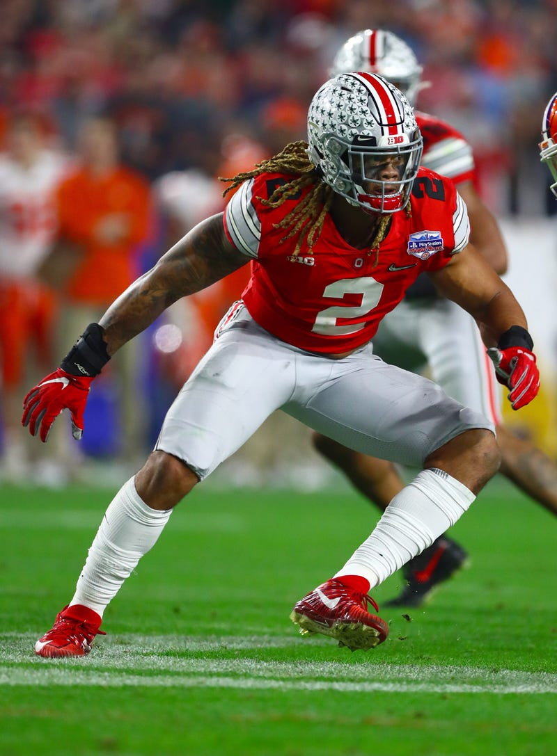 Ohio State Buckeyes defensive end Chase Young (2) rushes the passer against Clemson Tigers tackle Jackson Carman (79) in the 2019 Fiesta Bowl college football playoff semifinal game.