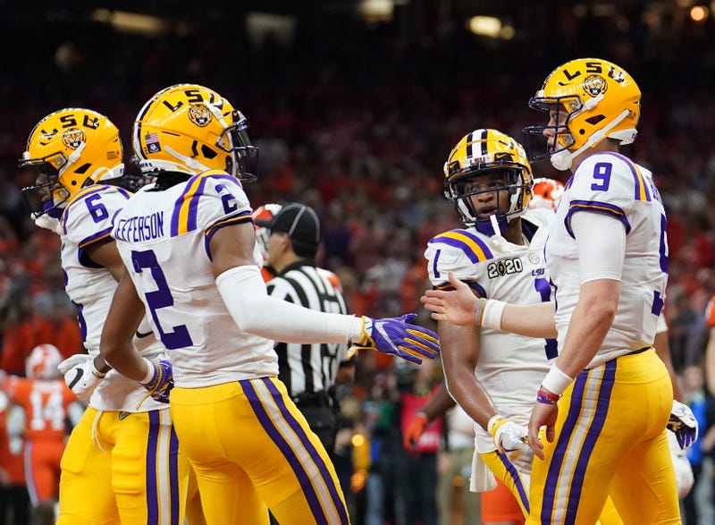 Jan 13, 2020; New Orleans, Louisiana, USA; LSU Tigers quarterback Joe Burrow (9) celebrates with wide receiver Justin Jefferson (2) after scoring a touchdown against the Clemson Tigers second quarter in the College Football Playoff national championship g
