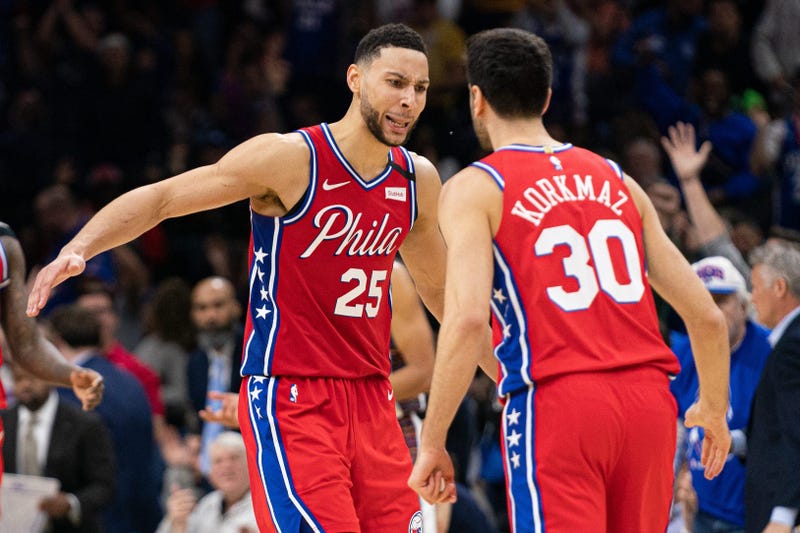 Philadelphia 76ers guard Ben Simmons (25) reacts to guard Furkan Korkmaz (30) score during the fourth quarter against the Brooklyn Nets at Wells Fargo Center.