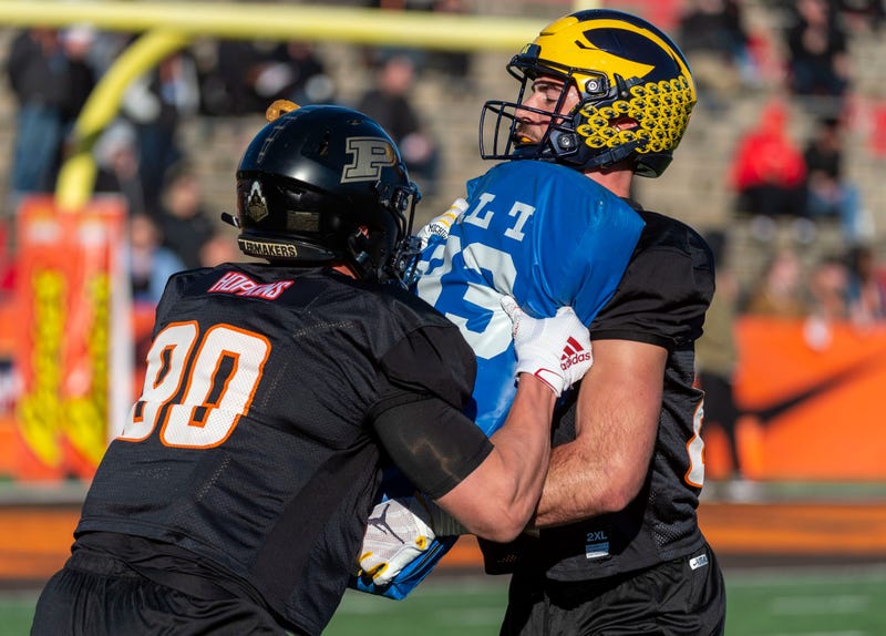 North tight end Brycen Hopkins of Purdue (89) spars with tight end Sean McKeon of Michigan (86) during Senior Bowl practice at Ladd-Peebles Stadium.