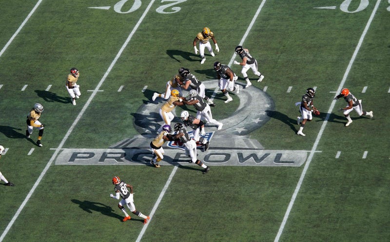 Jan 26, 2020; Orlando, Florida, USA; General overall view as AFC quarterback Lamar Jackson of the Baltimore Ravens (8) prepares to hand the ball off to AFC running back Nick Chubb of the Cleveland Browns (24) on the Pro Bowl logo in the first quarter in t
