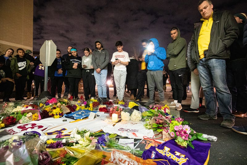 Jan 26, 2020; Ardmore, Pennsylvania, USA; Fans gather to pay their respects to NBA Kobe Bryant outside Lower Merion High School. Mandatory Credit: Bill Streicher-USA TODAY SportsJan 26, 2020; Ardmore, Pennsylvania, USA; Fans gather to pay their respects t