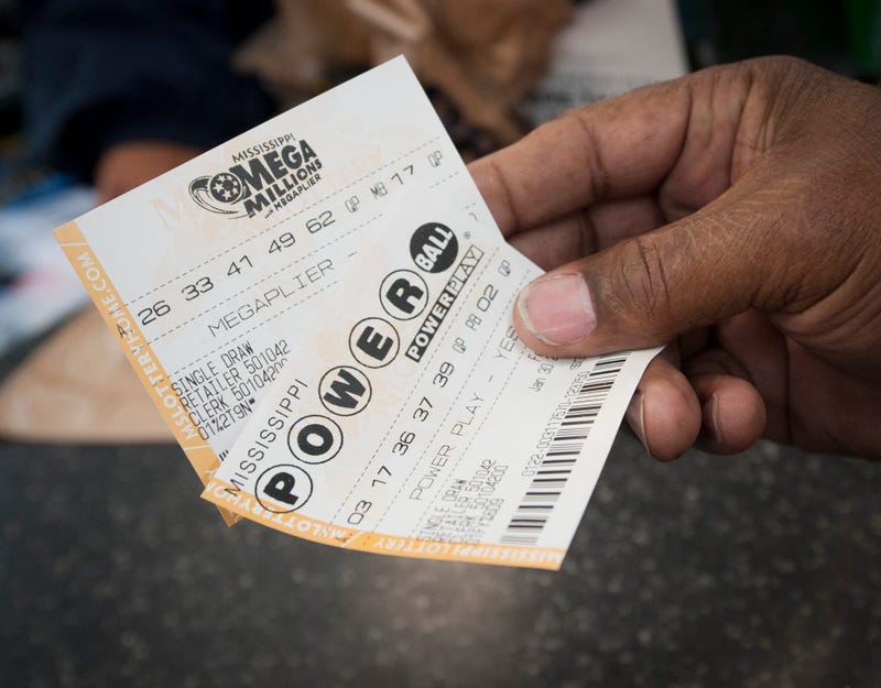 A customer at Sprint Mart in Jackson buys one of each ticket Thursday mA customer at Sprint Mart in Jackson buys one of each ticket Thursday morning oorning on the first day of ticket sales for Mega Millions and Powerball in Mississippi Jan. 30. Lottery 3