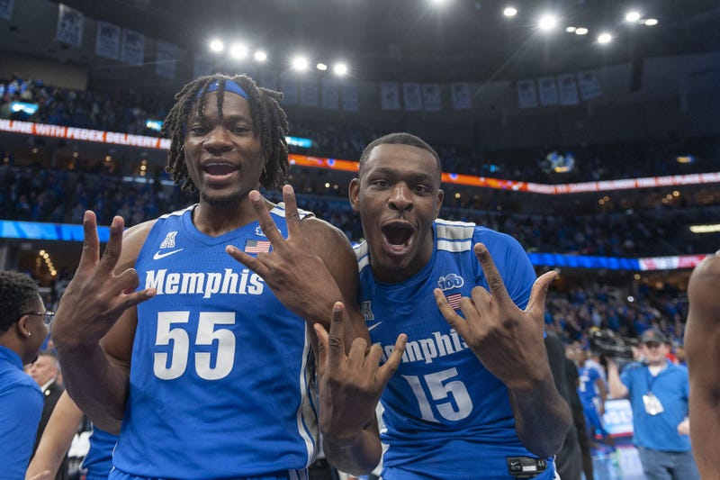 Feb 22, 2020; Memphis, Tennessee, USA; Memphis Tigers forward Precious Achiuwa (55) and forward Lance Thomas (15) celebrate after the game against the Houston Cougars at FedExForum.
