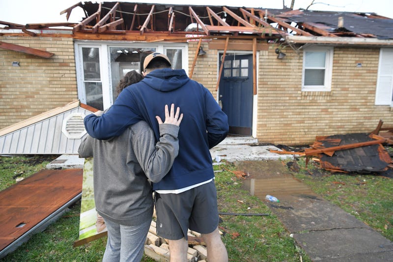 Meg Selby and Mac Warren survey the damage to their home in StanfordMeg Selby and Mac Warren survey the damage to their home in Stanford Estates after a tornado touc Estates after a tornado touched down Tuesday, March 3, 2020 in Nashville, Tenn., Sem 9608