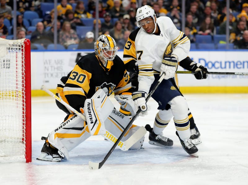 Pittsburgh Penguins goaltender Matt Murray (30) and Buffalo Sabres right wing Wayne Simmonds (17) look for the puck during the second period at KeyBank Center.