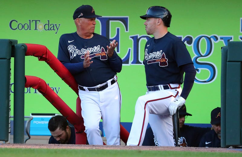 Mar 9, 2020; North Port, Florida, USA;Atlanta Braves manager Brian Snitker (43) talks with first baseman Freddie Freeman (5) during the third inning against the Boston Red Sox at CoolToday Park. Mandatory Credit: Kim Klement-USA TODAY Sports