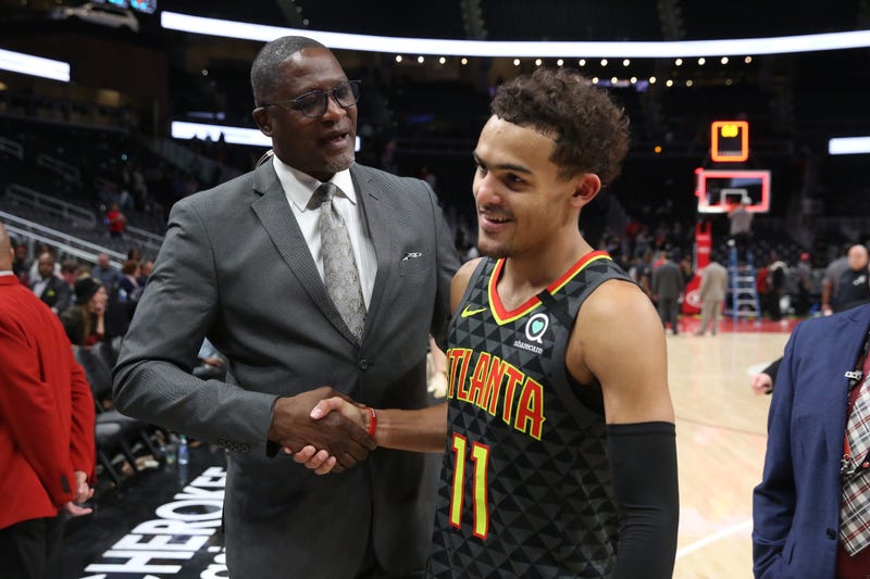 Mar 9, 2020; Atlanta, Georgia, USA; NBA Hall of Fame player Dominique Wilkins, left, congratulates Atlanta Hawks guard Trae Young (11) after their double overtime win against the Charlotte Hornets at State Farm Arena. Mandatory Credit: Jason Getz-USA TODA