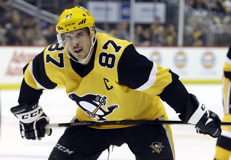 Penguins center Sidney Crosby looks on before a face-off