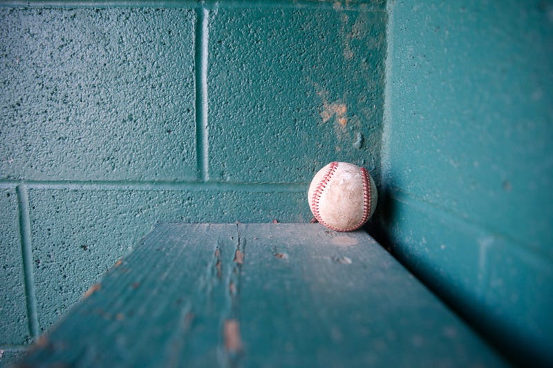 A baseball left inside a dugout at the baseball field at Maurer Geering Park on March 16, 2020. Empty Ball Fields