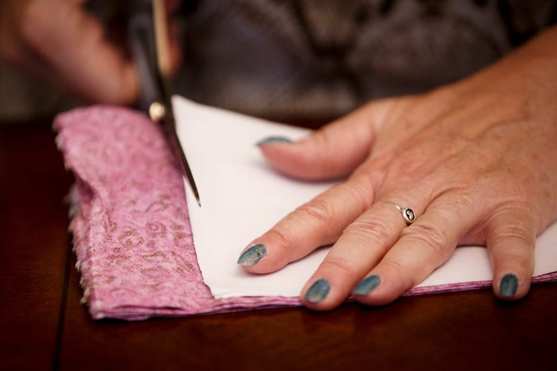 Cindy Williams of Des Moines works on making face masks at her home on Saturday, March 21, 2020, in Des Moines. \"It's sad we have to do it,\" Williams said, \"but it's a great opportunity to feel like you are doing something.\" 015 Masks 0321
