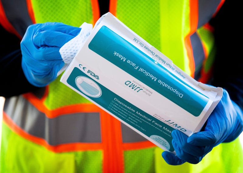A donated box of disposable face masks is sanitized at the Jacob Building at Knoxville s Chilhowee Park on Friday, April 3, 2020. The Personal Protective Equipment Collection Drive kicked off on Friday and will held at the Jacob Building at Chilhowee Park