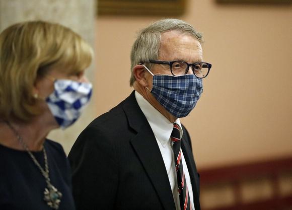 Ohio Gov. Mike DeWine and First Lady Fran DeWine leave the State Room after giving an update on the state's response to the ongoing COVID-19 pandemic Tuesday, April 10, at the Ohio Statehouse. Dewine Facemask