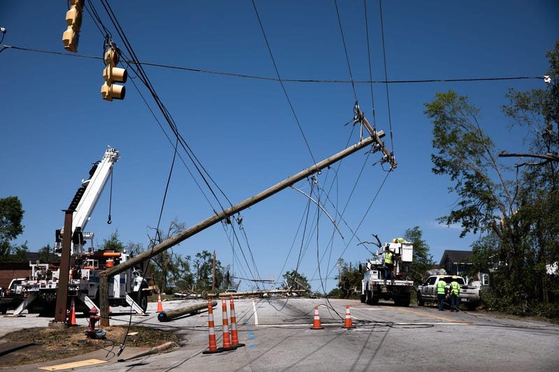 Utility workers begin assessing damage in Seneca Tuesday, April 14, 2020, after an EF3 tornado with 160 mph winds touched down.