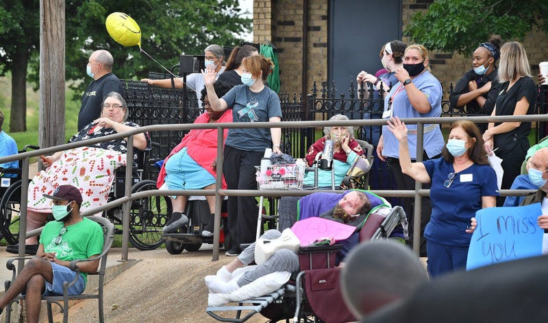 Nursing home residents celebrate outside