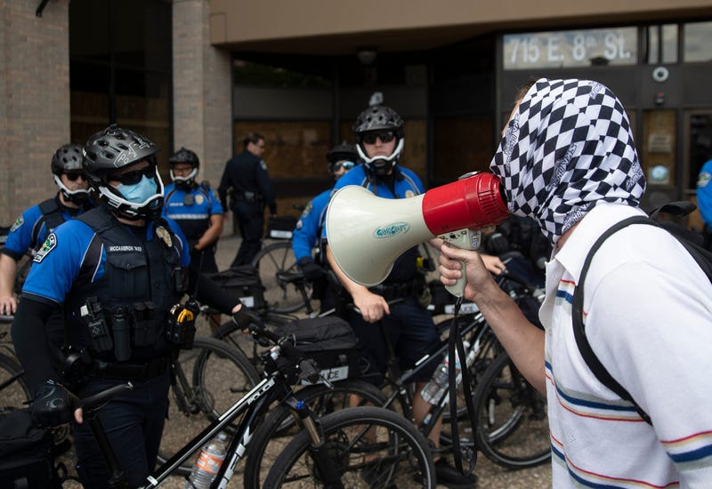Protester confronting APD officers