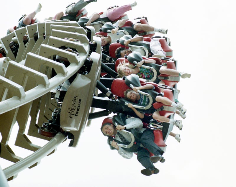 Roller coaster lovers are hanging on during the first few spins of the new Opryland U.S.A. theme park's Hangman on June 8, 1995. \"That's a real ride, that's not a baby ride,\" said country singer Chely Wright after she finished the open-air ride.