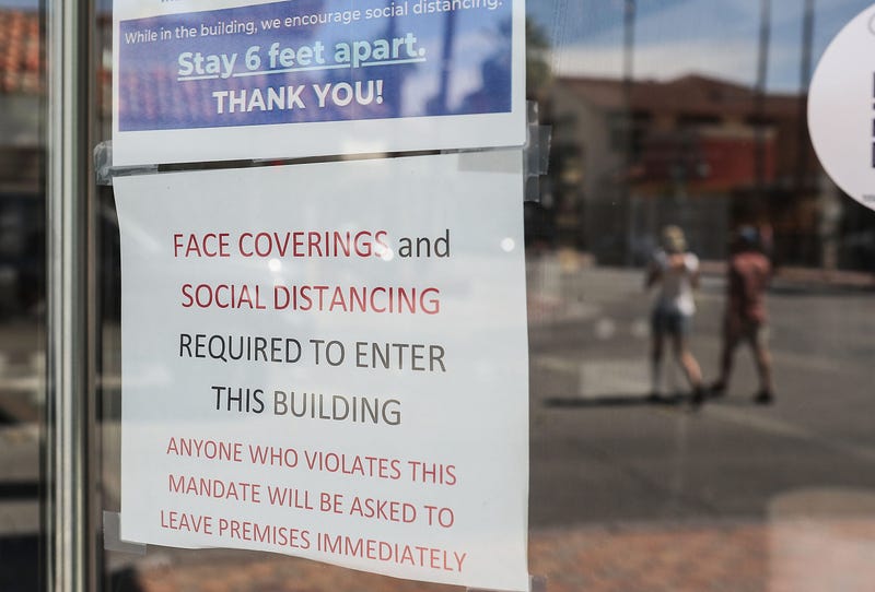 A sign explains the new rules at Lulu California Bistro in Palm Springs, June 12, 2020.